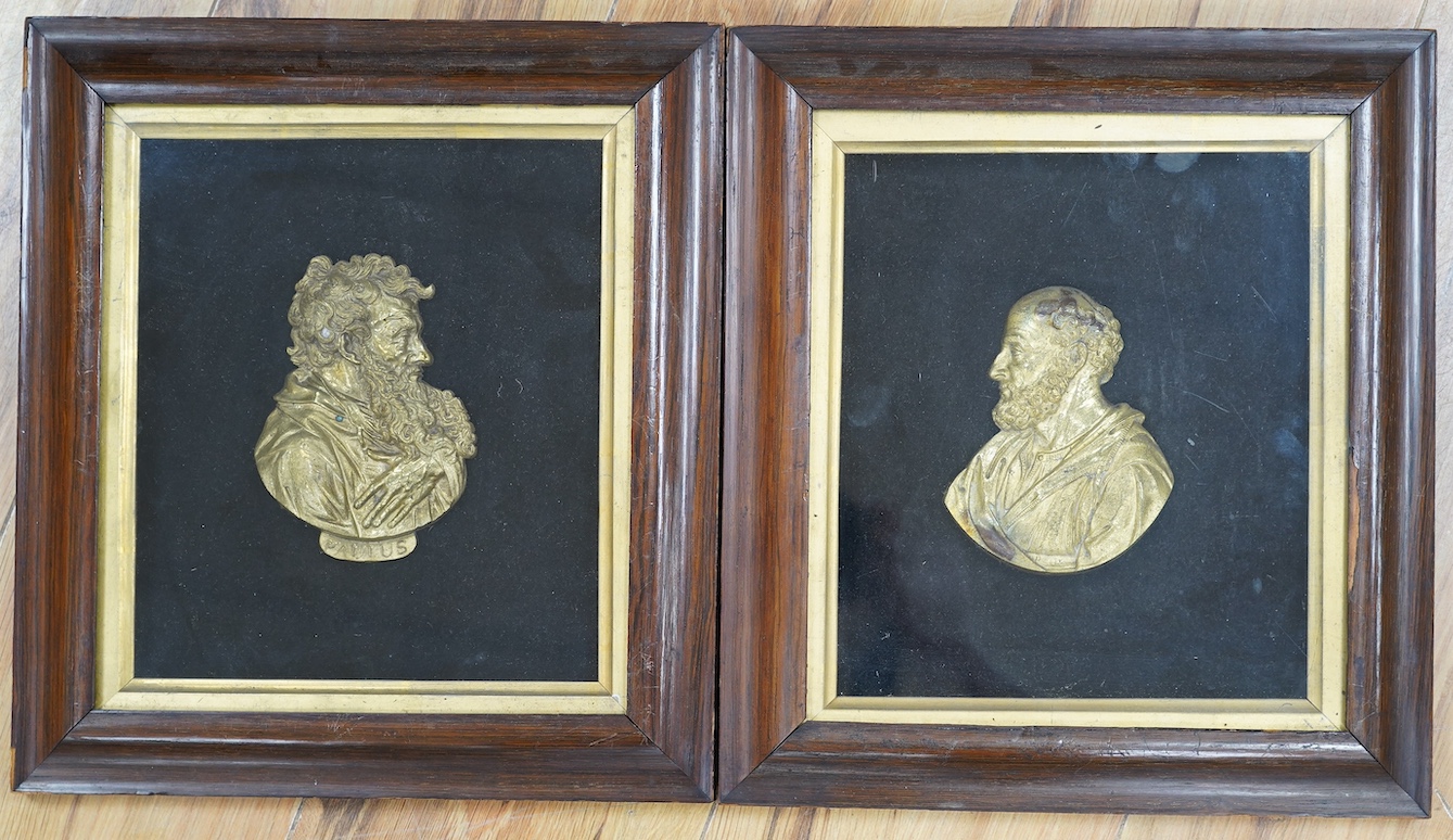 A pair of 19th century rosewood framed brass reliefs of St. Peter and St. Paul, 29cm wide, 32cm high including mount and frame. Condition - frames, one poor, masks in good condition